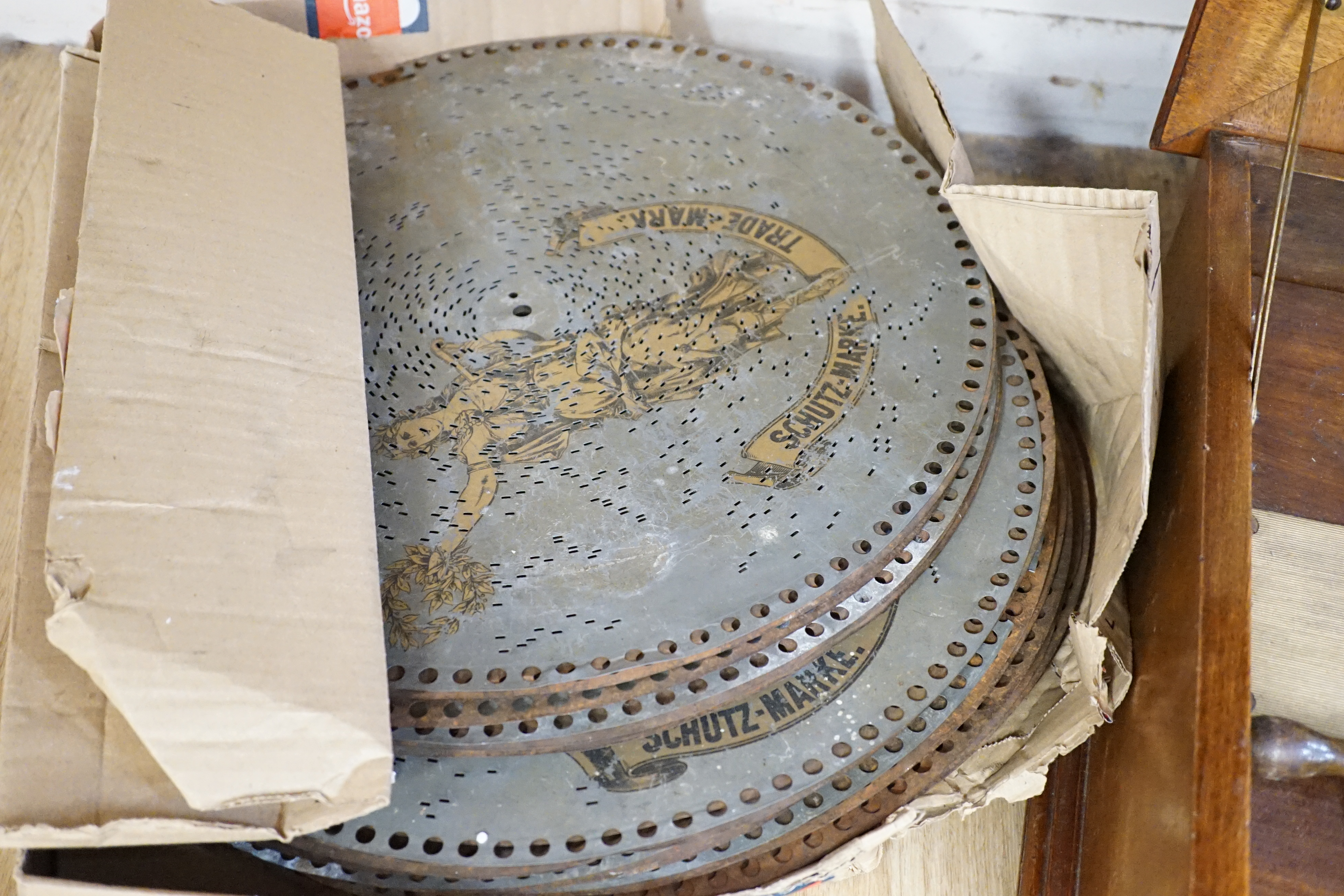 An early 20th century walnut cased polyphon and thirty discs